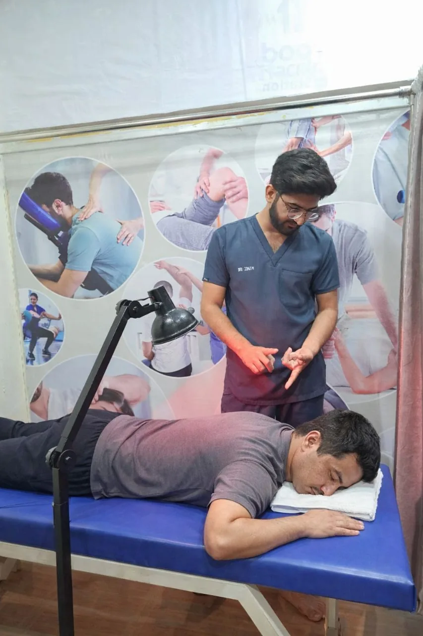 Physiotherapist performing manual therapy on a patient at PainFix Physiotherapy Clinic in Multan